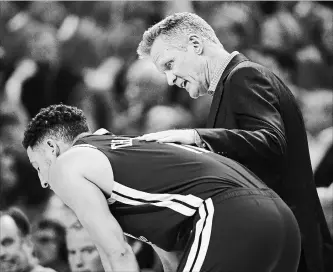  ?? FRANK GUNN THE CANADIAN PRESS ?? Golden State Warriors coach Steve Kerr talks with guard Klay Thompson. Thompson is sticking with Golden State, but can’t play until likely the latter portion of this coming season while he rehabs from the ACL surgery.