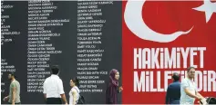  ?? (Alkis Konstantin­idis/Reuters) ?? PEOPLE MAKE their way next to a banner with the names of civilians and policemen killed during last weekend’s Turkish coup attempt, in Istanbul’s Taksim square yesterday. The slogan says ‘Sovereignt­y belongs to the nation.’