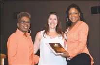  ??  ?? Shelley Mitchell, right, of New Horizons accepts the New Horizons Support Services Employer Award on behalf of employer Dat Jerk Caribbean Chargrill on Wednesday at the second annual Charles County Job Developers’ Alliance employer award breakfast at...