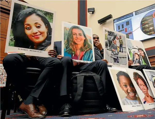  ?? AP ?? People holding photos of those lost in the Ethiopian Airlines and Lion Air crashes attend the House transporta­tion committee hearing this week.