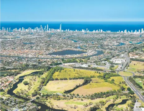  ??  ?? The land on which Bunnings hopes to build is a triangular vacant parcel fronting Nerang-Broadbeach Rd.