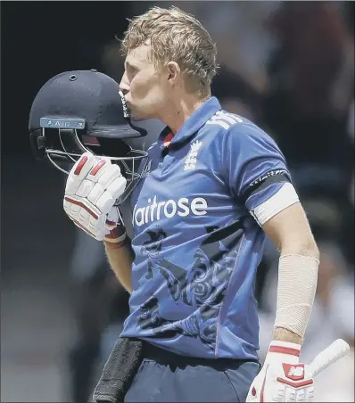  ?? PICTURE: AP PHOTO/RICARDO MAZALAN ?? LEADING BY EXAMPLE: Joe Root, the new England Test captain, kisses his helmet after scoring a century in yesterday’s third and final one-day internatio­nal with West Indies in Barbados.