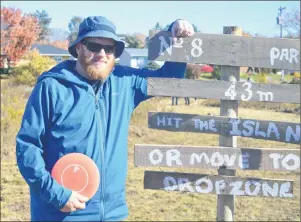  ?? DAVID JALA/CAPE BRETON POST ?? In this file photo, Cape Breton University associate professor of community studies Pat Maher is shown taking a break during a round of disc golf at the Rotary Park course in Sydney last autumn. Maher is researchin­g how our leisure-time activities...