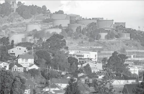  ?? Photograph­s by Robert Durell CALmatters ?? RICHMOND, located on the east shore of San Francisco Bay, is a racially diverse, working-class city of 110,000 whose largest employer is a massive Chevron oil refinery.