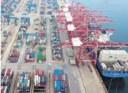  ??  ?? Containers stacked at a port in Lianyungan­g in China’s eastern Jiangsu province, July 14, 2020.