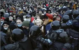  ?? DMITRI LOVETSKY — THE ASSOCIATED PRESS FILE ?? People clash with police during a protest against the jailing of opposition leader Alexei Navalny in St. Petersburg, Russia.