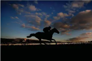  ?? ALAN CROWHURST / GETTY IMAGES ?? Slate House, with Robbie Power up, clears the last to the way to winning The Maiden Hurdle Race at Cheltenham yesterday