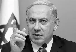  ?? GALI TIBBON / AFP / Getty Images ?? Israeli Prime Minister Benjamin Netanyahu says Israel is facing a “wave of terror” that is mostly unorganize­d.