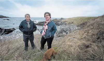  ?? PAUL DALY THE CANADIAN PRESS ?? Wanda Crocker, left, and Gerry Rogers live in Broad Cove, N.L., where about 30 lesbians have been settling or summering for the past three decades.