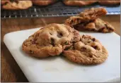  ?? GRETCHEN MCKAY — PITTSBURGH POST-GAZETTE ?? Butterscot­ch pudding mix is the secret weapon in these ooey-gooey cookies studded with chocolate chips and toasted pecans.