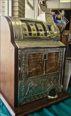  ??  ?? An ornate Mills slot machine made around 1915 is a gem of The History of Hot Springs Gambling Museum.