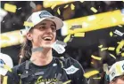  ?? LILY SMITH/THE DES MOINES REGISTER ?? Caitlin Clark reacts as confetti falls after Iowa won the Big Ten tournament basketball championsh­ip game on Sunday.