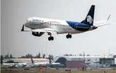  ??  ?? An Aeromexico airlines plane lands at the Benito Juarez Internatio­nal airport, in Mexico City, amid the Covid-19 pandemic.