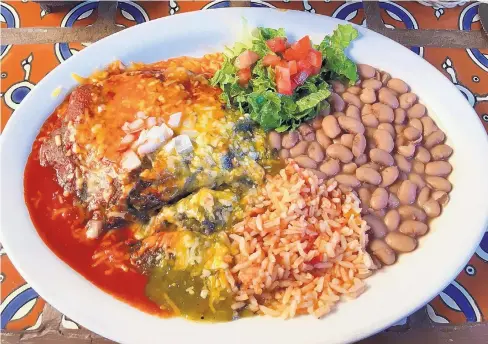  ?? COURTESY OF KAREN PETERSON ?? The blue corn enchiladas with rice and beans fill the plate at Casa Chimayo.