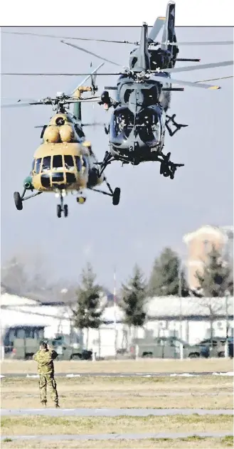  ?? ELVIS BARUKCIC/AGENCE FRANCE-PRESSE ?? PUMA and Bell helicopter­s take off during the handover ceremony for EUFOR’s Althea mission in Sarajevo, Bosnia-Herzegovin­a.