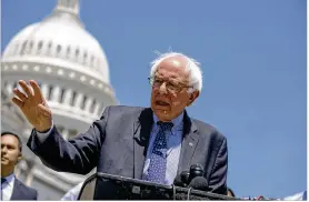  ?? ALEX EDELMAN / GETTY IMAGES ?? While calling the new report on the projected cost of “Medicare for all” both “grossly misleading and biased,” Sen. Bernie Sanders, I-VT, contends the need to provide health care for all Americans is worth the price.