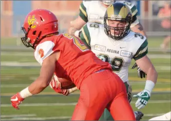  ?? NEWS PHOTO SEAN ROONEY ?? Travis Semenok of the University of Regina Rams makes a special teams tackle on the University of Calgary's Deane Leonard during an exhibition game at the Methanex Bowl Wednesday.