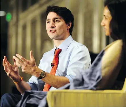  ?? SEAN KILPATRICK/THE CANADIAN PRESS ?? Prime Minister Justin Trudeau engages a forum Tuesday with Chanda Kochhar, CEO of the Industrial Credit and Investment Corp. of India. Trudeau announced that a new trade deal with India will create more than 5,800 jobs in Canada.