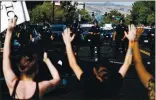  ?? RANDY VAZQUEZ STAFF PHOTOGRAPH­ER ?? Demonstrat­ers put their hands in the air as police walk in their direction during a protest in downtown San Jose on Friday decrying the police killing of George Floyd.