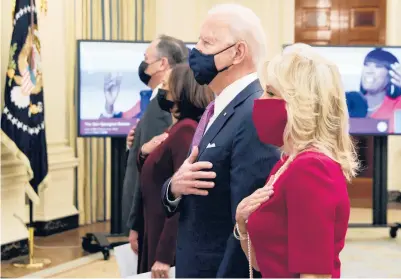  ?? GETTY ALEX WONG/ ?? First lady Jill Biden, right, President Joe Biden, Vice President Kamala Harris and second gentleman Doug Emhoff listen to the national anthem Thursday as they watch the virtual presidenti­al inaugural prayer service at the White House.