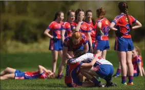  ??  ?? ISK players console each other after their All Ireland PPS Junior A Final defeat