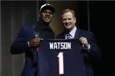  ?? MATT ROURKE — THE ASSOCIATED PRESS ?? Clemson’s Deshaun Watson poses with NFL commission­er Roger Goodell after being selected by the Texans after the Texans traded with the Brown for the No. 12 pick.