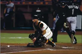  ?? NHAT V. MEYER — BAY AREA NEWS GROUP FILE ?? The San Francisco Giants’ Joey Bart waits for the ball as the Colorado Rockies’ Garrett Hampson (1) scores a run on a double hit by Raimel Tapia in the fifth inning at Oracle Park in San Francisco on Sept. 23.