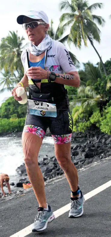  ??  ?? LEFT Laurelee Nelson racing in Kona 2019