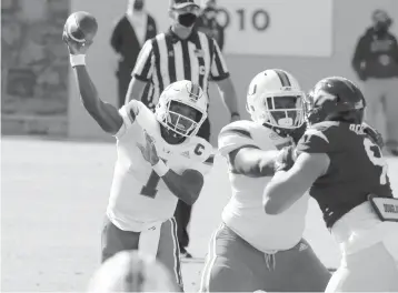  ?? MATT GENTRY/THE ROANOKE TIMES ?? Hurricanes quarterbac­k D’Eriq King threw for 255 yards and connected with Mark Pope for the game-winning touchdown to lead Miami to a come-from-behind victory.