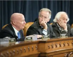  ?? J. SCOTT APPLEWHITE - THE ASSOCIATED PRESS ?? House Ways and Means Committee Chairman Kevin Brady, R-Texas, left, joined by U.S. Rep. Richard Neal, D-Massachuse­tts, the ranking member, and U.S. Rep. Sander Levin, D-Michigan, offers his manager’s amendment as the GOP tax bill debate enters the...