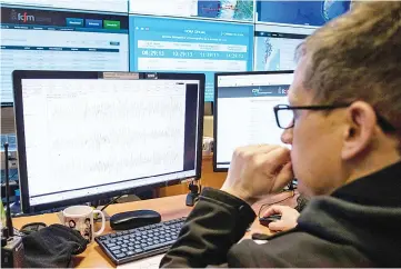  ??  ?? A technician of the National Seismologi­cal Centre (CSN) of the University of Chile, organisati­on in charge of monitoring the seismic activity in the Chilean territory, works in Santiago. Chile has put the San Ramon geological fault under vigilance to...