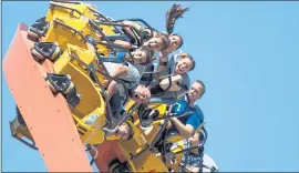  ?? DAI SUGANO — STAFF PHOTOGRAPH­ER ?? Amusement park visitors react as they ride the new RailBlazer, the West Coast’s first single-rail steel roller coaster, at California’s Great America in Santa Clara.