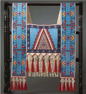  ??  ?? Beverly Bear King Moran (Standing Rock Lakota) Midnight Dream Horse collar, lane-stitched beadwork on hide, tin cones, dyed horsehair 46 × 22 inches