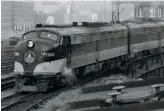  ?? John H. Kuehl ?? B&O E8 1439 — the stage for author Stewart’s “life-altering adventure” in early 1972 — leads the Capitol Limited out of North Western Station, Chicago, in November ’69.