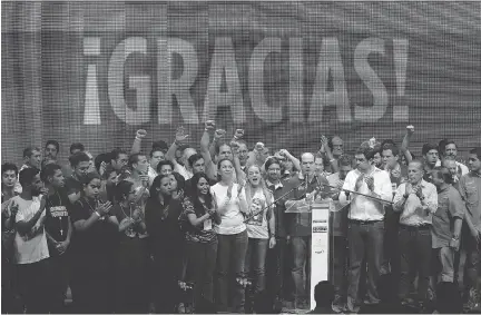  ?? ARIANA CUBILLOS/THE ASSOCIATED PRESS ?? Opposition leaders celebrate after the results of a symbolic referendum in Caracas, Venezuela on July 16. The country’s opposition said more than 7.1 million people voted in a symbolic rejection of the government’s plan to rewrite the constituti­on.