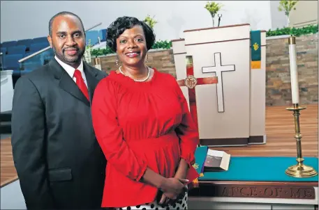  ?? [NATE BILLINGS/ THE OKLAHOMAN] ?? The Rev. Elvyn Hamilton and the Rev. Bessie Hamilton, the new senior pastors of Quayle United Methodist Church, stand in the sanctuary of the church, 5001 N Everest in Oklahoma City.