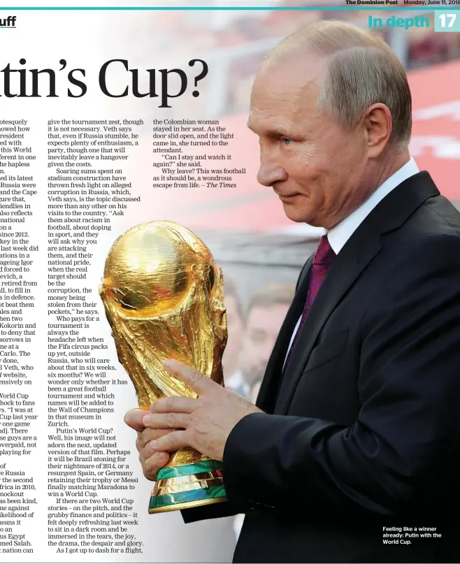  ??  ?? Feeling like a winner already: Putin with the World Cup.