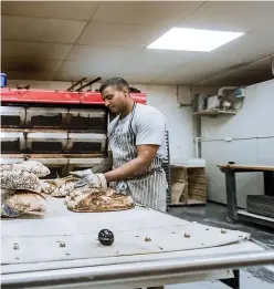  ?? ROSA WOODS/ STUFF (left) ?? Sam Forbes owner of Shelly Bay Bakery in Wellington has been forging direct relationsh­ips with organic grain farmers in an effort to eventually produce all his bread with local organic flour. Suzy Rea from Marton is one of his suppliers.