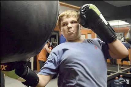  ?? Joey smitH/truro Daily News ?? Jeremiah Mosher, 13, works out on the uppercut bag at the Hubtown Boxing Club. Mosher has been a member of the club for three years.