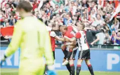  ??  ?? ROTTERDAM: Feyenoord’s Dirk Kuyt (C) celebrates with teammates after scoring a goal during the Eredivisie league football match Feyenoord versus Heracles at the Kuip Stadium. — AFP