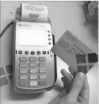  ??  ?? AsianLife swipe card terminal makes it easy for patients to avail medical services.