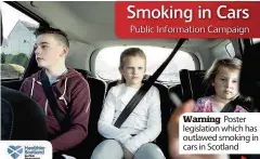  ??  ?? Warning Poster legislatio­n which has outlawed smoking in cars in Scotland