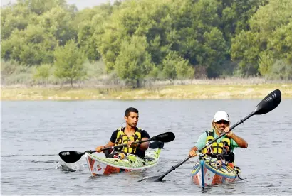  ?? KT file ?? Two kayakers during their expedition at the Mangroves National Park in Abu Dhabi. Set within the mangrove forest, the park is a haven for lovers of outdoor activities and for those who are in harmony with nature. —