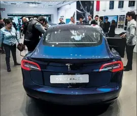  ?? Josep Lago AFP/Getty Images ?? TESLA says it has made significan­t improvemen­ts to address the Model 3 problems covered in Consumer Reports’ reliabilit­y survey for July through September.