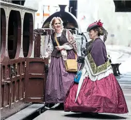  ??  ?? The closure of Didcot Railway Centre in late March due to the covid-19 pandemic has not only led to the cancellati­on of events such as the Railcar Rendezvous at Easter, but also halted a programme to introduce period re-enactors. A small group of new volunteers has been establishe­d and training was underway. Two volunteers in period dress are pictured with the venue’s replica second-class broad gauge coach. FRANK DUMBLETON