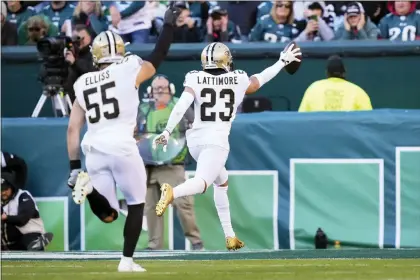  ?? MATT ROURKE — THE ASSOCIATED PRESS ?? New Orleans Saints cornerback Marshon Lattimore (23) returns an intercepti­on for a touchdown in the second half against the Eagles on Sunday afternoon at Lincoln Financial Field.