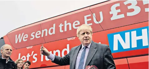  ??  ?? Claim and counter-claim: Boris Johnson, campaignin­g for Leave in May 2016, with the bus slogan that claimed we send £350 million a week to the European Union