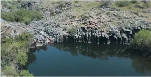  ?? (Oren Oppenheim) ?? YOUTHS CHAT near the Golan Height’s Zavitan Stream in 2017.