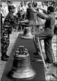  ?? BULLIT MARQUEZ/AP ?? Philippine personnel unload three church bells Tuesday seized as war trophies by U.S. troops in 1901.