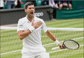  ?? Kirsty Wiggleswor­th / Associated Press ?? Novak Djokovic celebrates after defeating Denis Shapovalov in straight sets during the men's singles semifinals at Wimbledon on Friday.